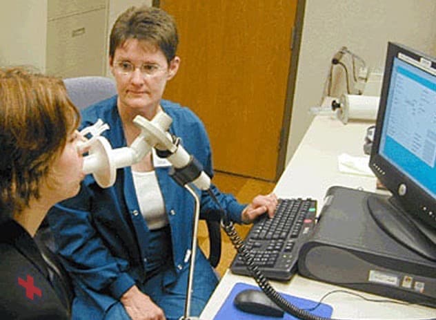 Person using a spirometer
